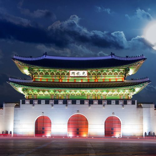 Gyeongbokgung palace and full moon at night in Seoul, South Korea.
